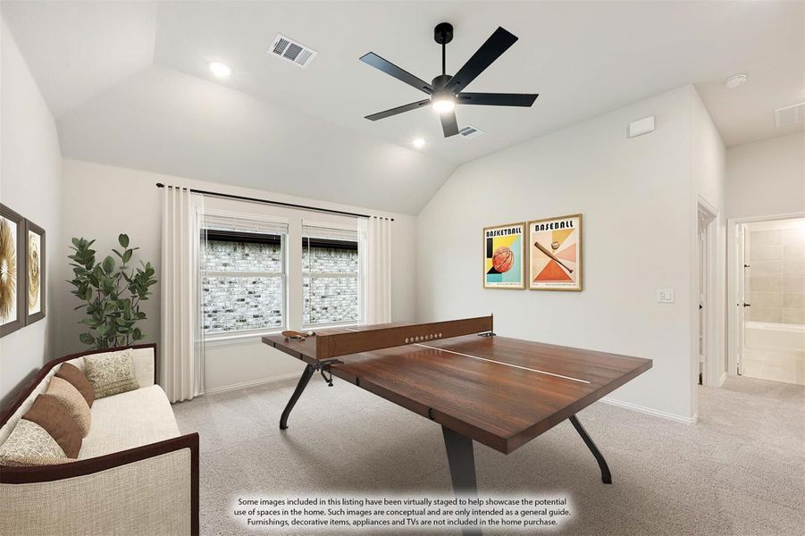 Game room with ping pong table, vaulted ceiling, ceiling fan, and carpet flooring Game room with ping pong table, vaulted ceiling, ceiling fan, and carpet flooring