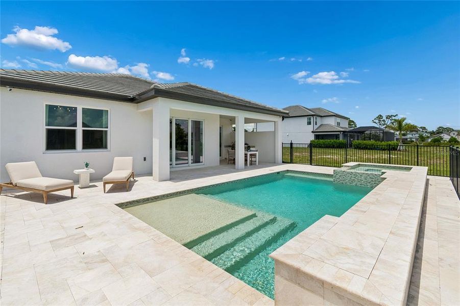 Exterior details and patio area of a home in Cassata Lakes, Nokomis (Image 19).
