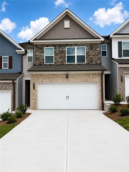 Front exterior of a new home in Somerset at Riverbrook, Gainesville, GA, highlighting curb appeal (Image 1). Front exterior of a new home in Somerset at Riverbrook, Gainesville, GA, highlighting curb appeal (Image 1).