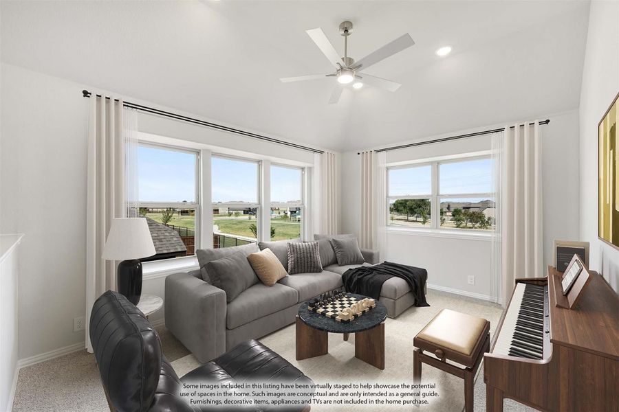 Bright living room with gray sectional sofa, ceiling fan, piano, and large windows with neighborhood views