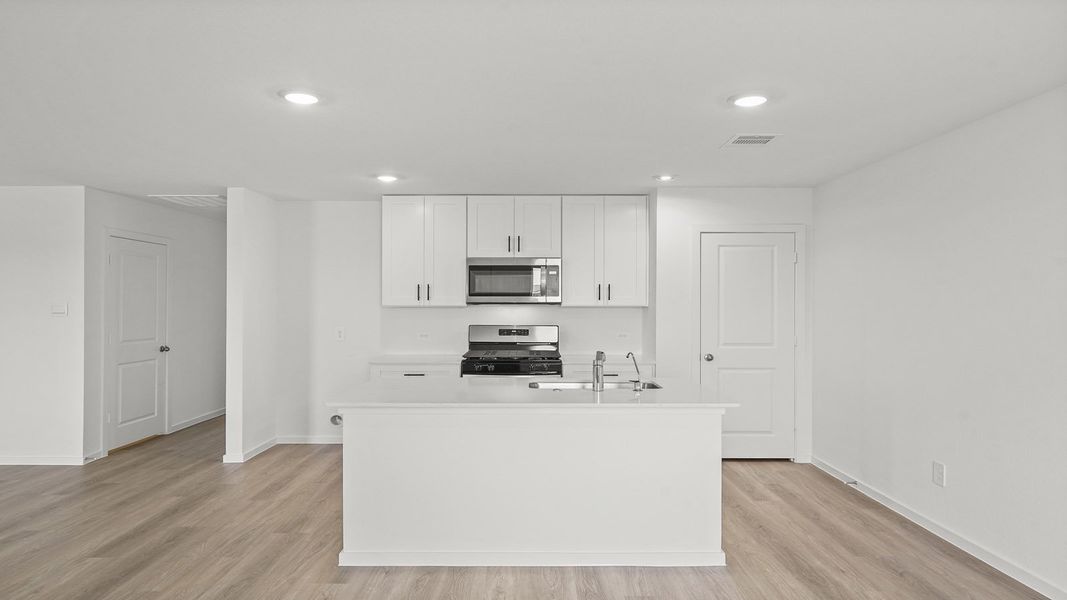 Furnished interior view inside a new home in Sunterra, Katy (Image 6).