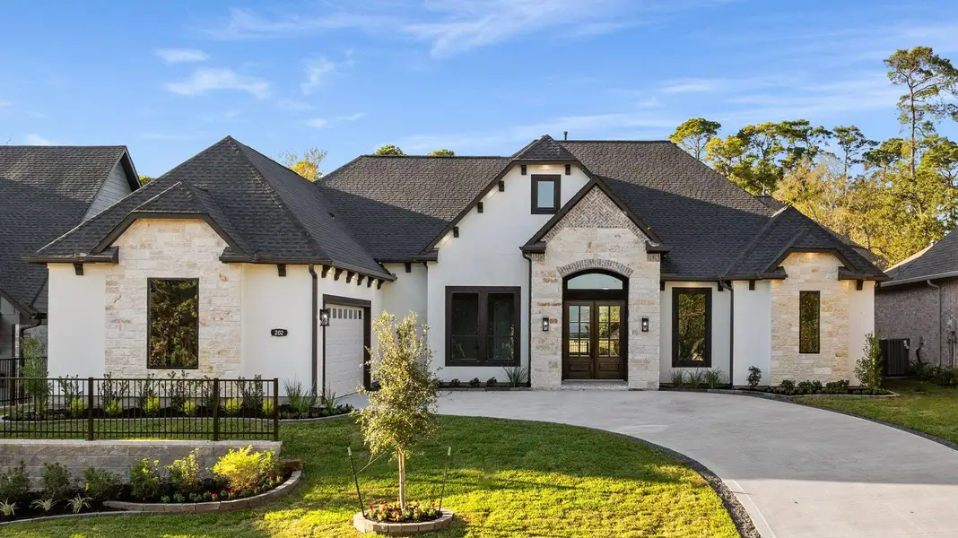 Front exterior of a new home in , Montgomery, TX, highlighting curb appeal (Image 2).