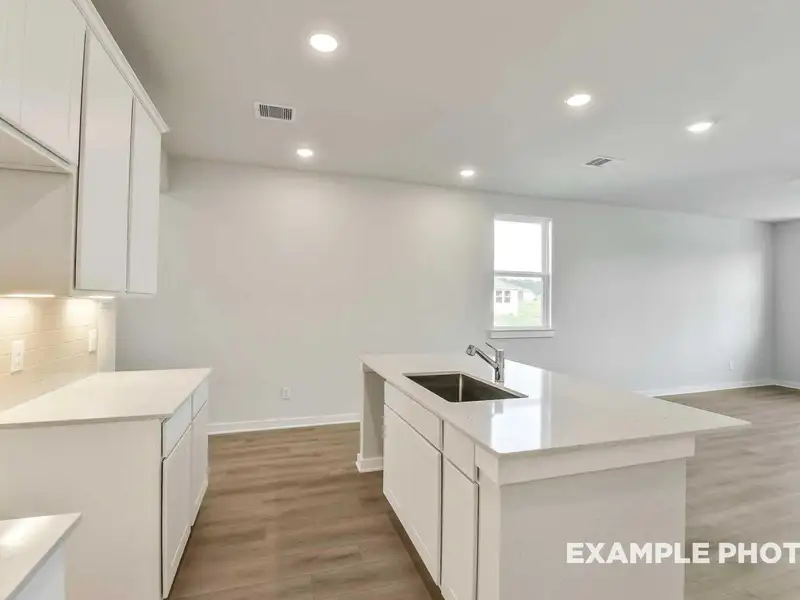 Furnished interior view inside a new home in Caney Creek Place, Conroe (Image 6).