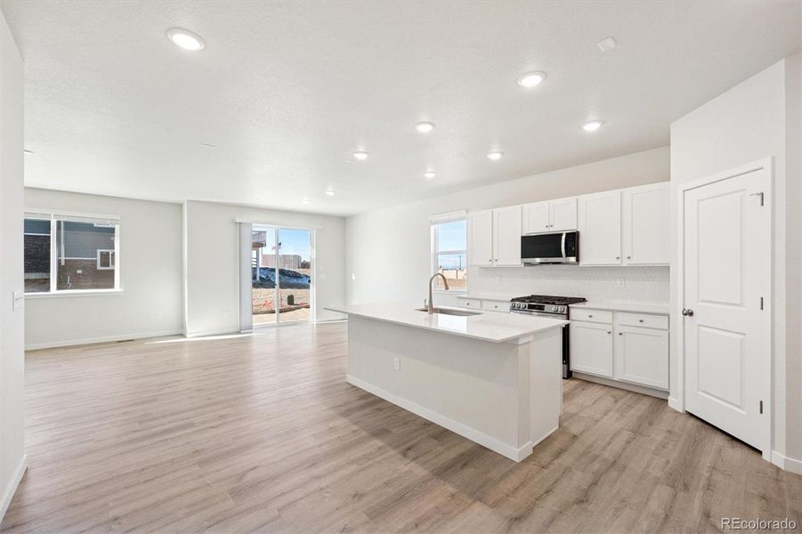 Furnished interior view inside a new home in The Aurora Highlands, Aurora (Image 5).