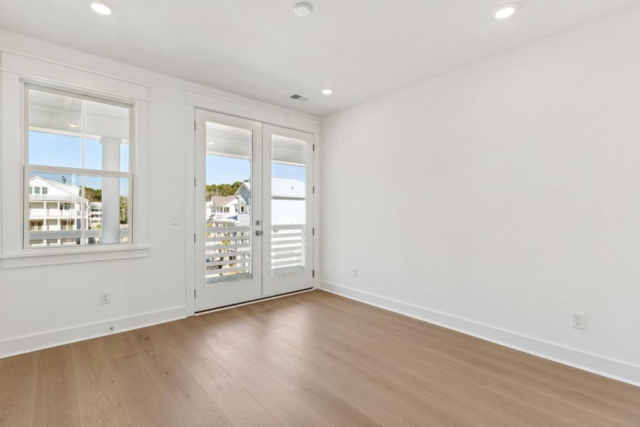 Spacious, unfurnished interior of a new home in Overlook at Copahee Sound, Awendaw (Image 53).