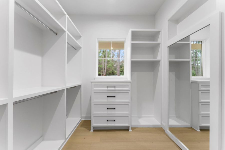 Custom closet with plenty of built-ins.