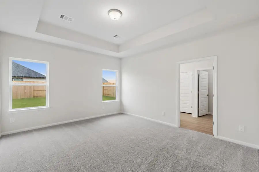 The Oakshire II- Primary Bedroom with Tray Ceiling.  Sample image for illustration; upgrades, options, and colors may vary.
