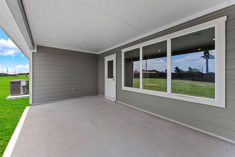 Exterior details and patio area of a home in Railhead, Cedar Creek (Image 3).