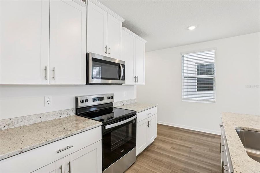 Furnished interior view inside a new home in The Meadow at Crossprairie Townes, St. Cloud (Image 11).