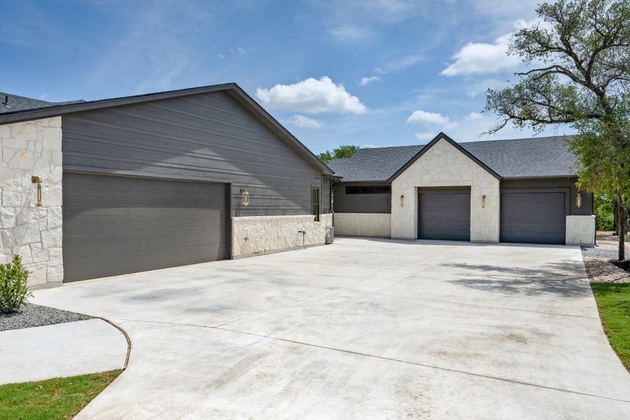 Front exterior of a new home in , Liberty Hill, TX, highlighting curb appeal (Image 24).