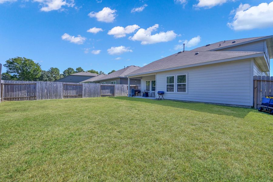 Exterior details and patio area of a home in Summerwood Trails, Willis (Image 25). Exterior details and patio area of a home in Summerwood Trails, Willis (Image 25).