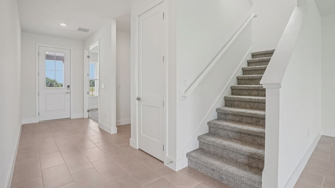 Plumeria Floor Plan interior entry by DRB Homes in Trailside located in Mount Dora, FL Plumeria Floor Plan interior entry by DRB Homes in Trailside located in Mount Dora, FL