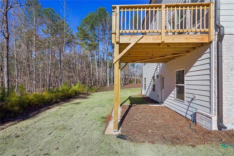 Exterior details and patio area of a home in The Pointe at Heron Bay, Locust Grove (Image 20).