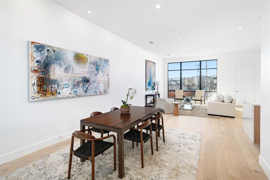 Dining area with light hardwood / wood-style floors