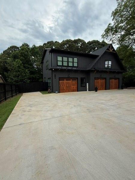 Front exterior of a new home in , Buford, GA, highlighting curb appeal (Image 34). Front exterior of a new home in , Buford, GA, highlighting curb appeal (Image 34).