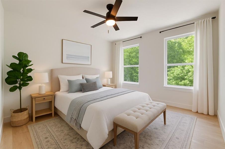 Bedroom with light wood-style flooring and a ceiling fan