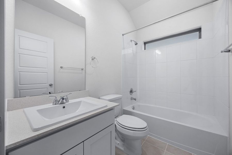 Bathroom in the Cypress home plan by Trophy Signature Homes - REPRESENTATIVE PHOTO