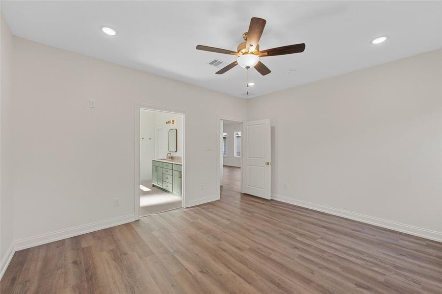 Spare room featuring light wood-type flooring, recessed lighting, and a ceiling fan Spare room featuring light wood-type flooring, recessed lighting, and a ceiling fan