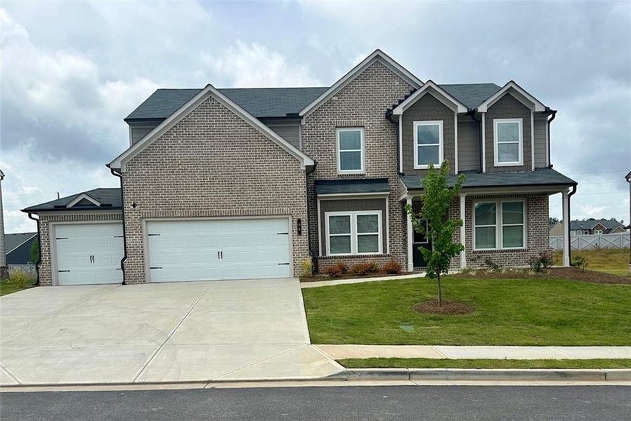 Front exterior of a new home in , Auburn, GA, highlighting curb appeal (Image 1). Front exterior of a new home in , Auburn, GA, highlighting curb appeal (Image 1).