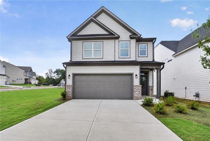 Front exterior of a new home in Villas at Dawsonville, Dawsonville, GA, highlighting curb appeal (Image 24). Front exterior of a new home in Villas at Dawsonville, Dawsonville, GA, highlighting curb appeal (Image 24).