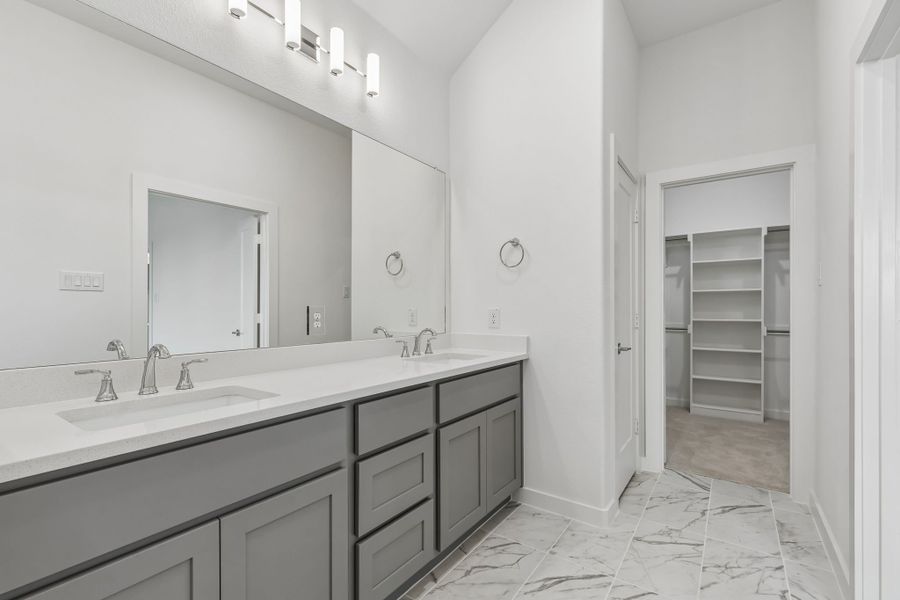 Primary Bathroom in the Claret home plan by Trophy Signature Homes – REPRESENTATIVE PHOTO