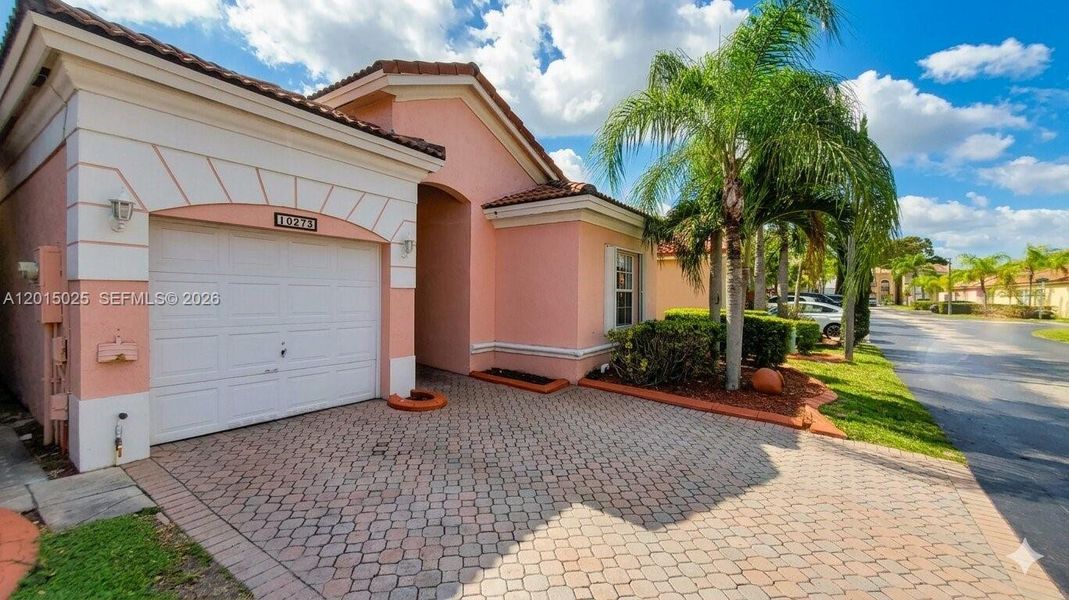 Front exterior of a new home in , Miami, FL, highlighting curb appeal (Image 1). Front exterior of a new home in , Miami, FL, highlighting curb appeal (Image 1).