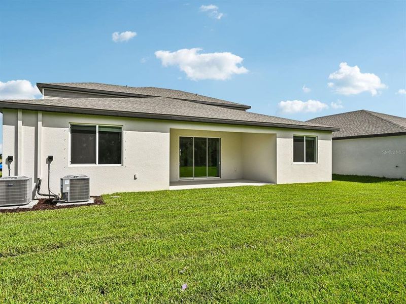 Exterior details and patio area of a home in Oakfield Trails - Signature Series, Parrish (Image 3).