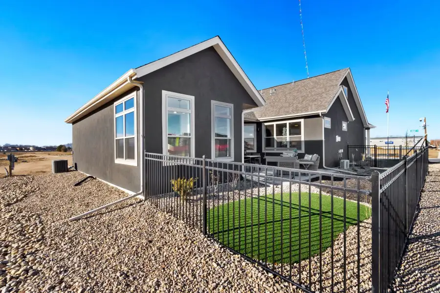Exterior details and patio area of a home in The Courtyards at Lupton Village, Fort Lupton (Image 21).