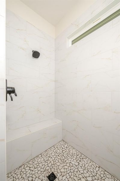 Full bathroom with tiled shower