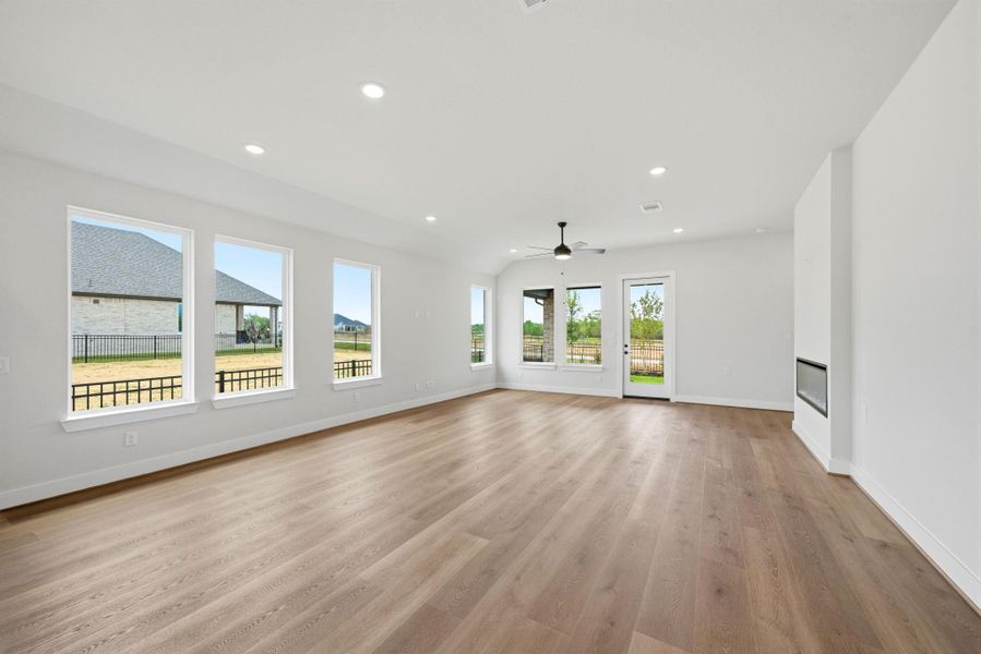 Spacious open-concept living area filled with natural light and backyard views—perfect for entertaining.