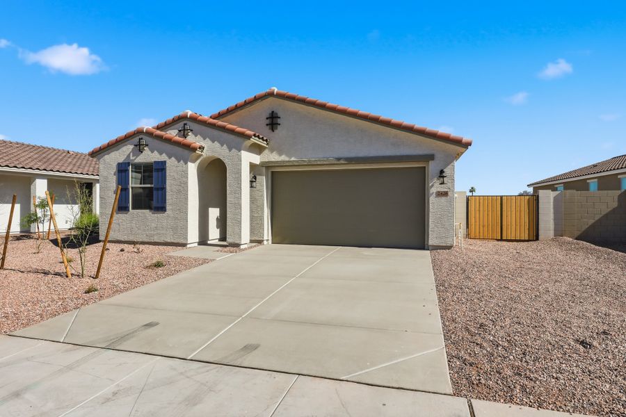 Front exterior of a new home in Bethany Grove, Glendale, AZ, highlighting curb appeal (Image 2).