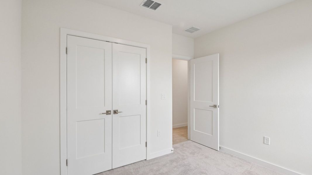 Furnished interior view inside a new home in Grasslands West, Lakeland (Image 28).