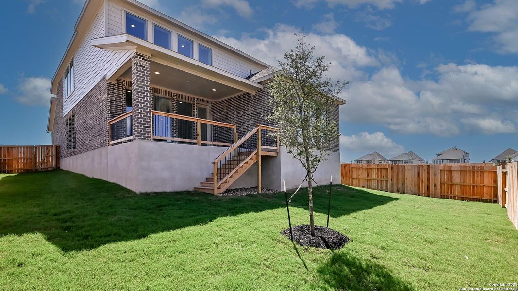 Front exterior of a new home in Homestead 55', Cibolo, TX, highlighting curb appeal (Image 25). Front exterior of a new home in Homestead 55', Cibolo, TX, highlighting curb appeal (Image 25).