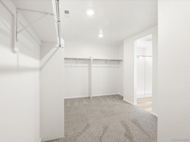 Spacious, unfurnished interior of a new home in Ridgeline Vista: The Flora Collection, Brighton (Image 16).