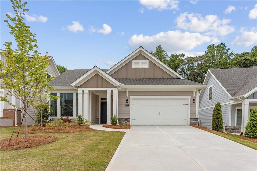 Front exterior of a new home in The Courtyards at Bailey Farms, Dacula, GA, highlighting curb appeal (Image 23).