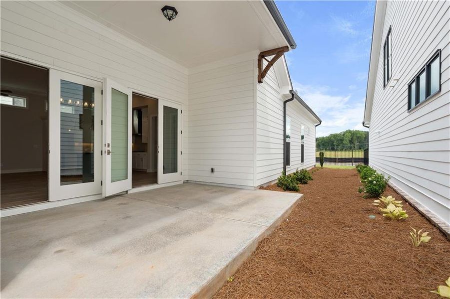 Exterior details and patio area of a home in Promenade at Sawnee Village, Cumming (Image 18).