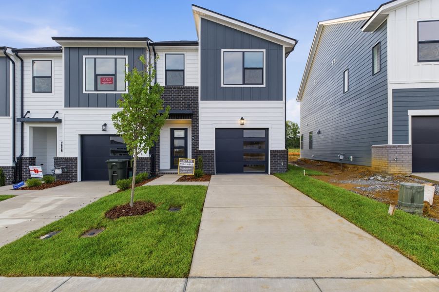 Front exterior of a new home in Nexus Townhomes, Gallatin, TN, highlighting curb appeal (Image 2).