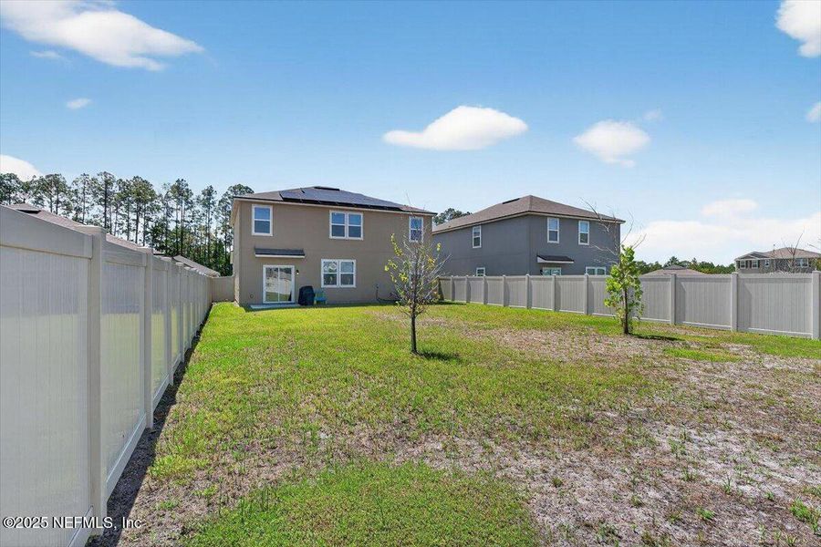 Front exterior of a new home in River Glen Express, Yulee, FL, highlighting curb appeal (Image 27).