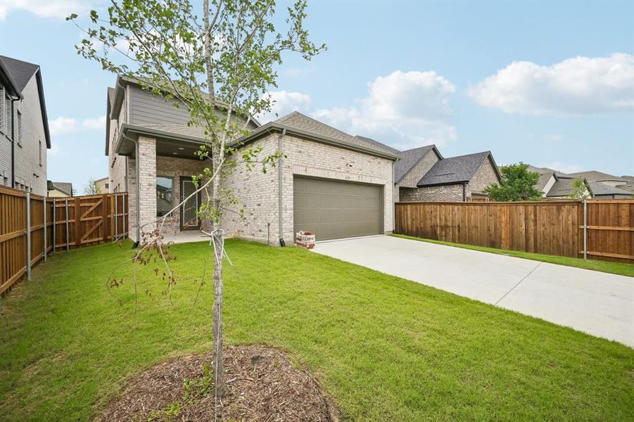 With a cozy covered back patio and nicely sized fenced yard, the entire family can enjoy the great outdoors in this wonderful back yard!