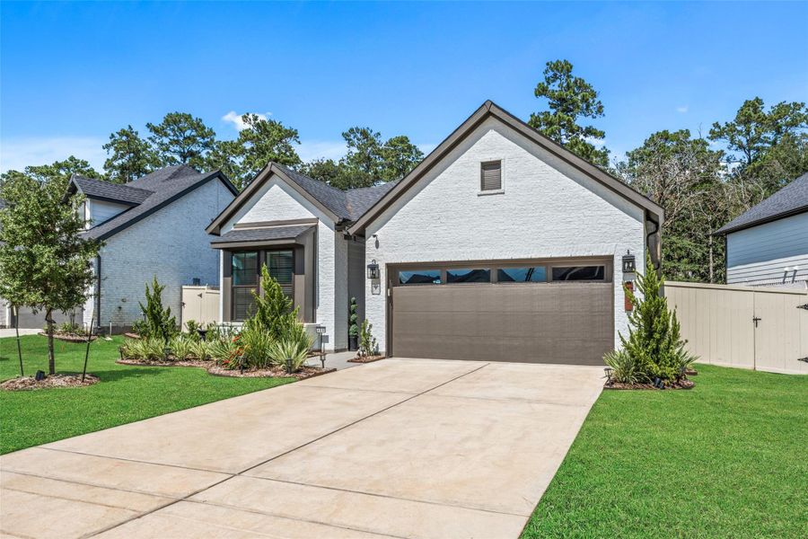 Front exterior of a new home in Audubon - Terrace Collection, Magnolia, TX, highlighting curb appeal (Image 25).