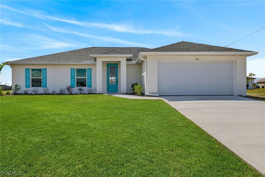 Front exterior of a new home in Cape Coral, Cape Coral, FL, highlighting curb appeal (Image 1). Front exterior of a new home in Cape Coral, Cape Coral, FL, highlighting curb appeal (Image 1).