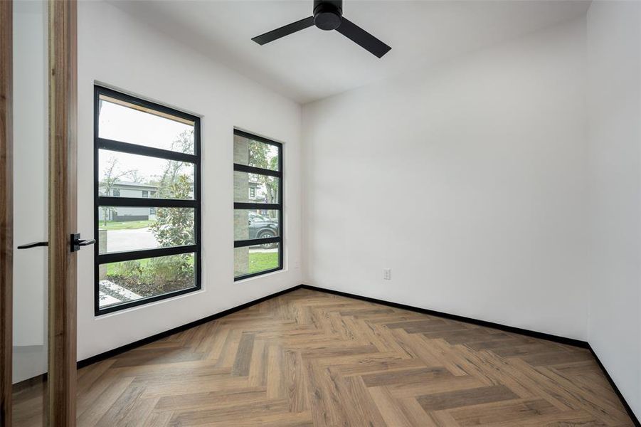 Unfurnished room featuring a ceiling fan and baseboards Unfurnished room featuring a ceiling fan and baseboards