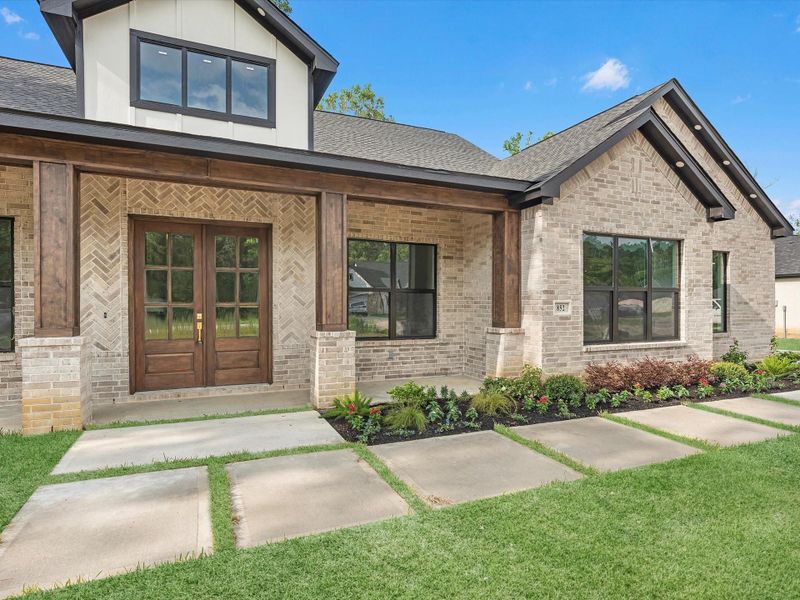 Front exterior of a new home in , Dayton, TX, highlighting curb appeal (Image 23). Front exterior of a new home in , Dayton, TX, highlighting curb appeal (Image 23).