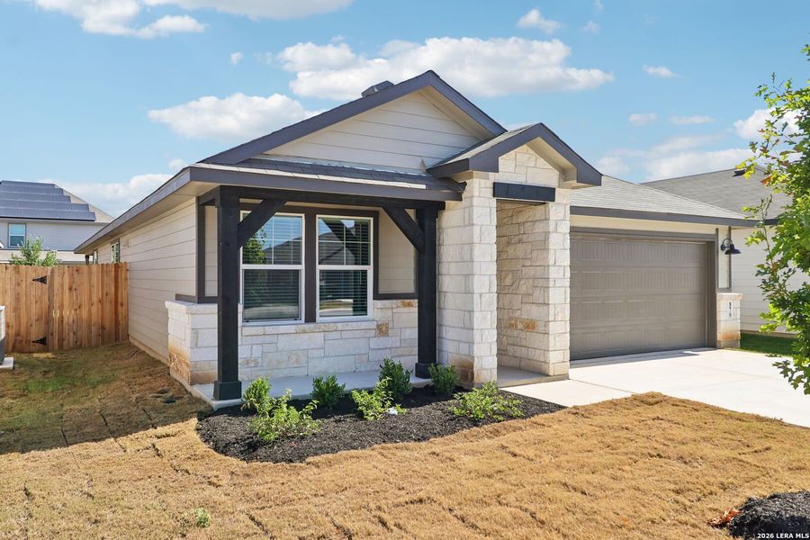 Front exterior of a new home in Estancia Ranch - Premier Series, San Antonio, TX, highlighting curb appeal (Image 25).