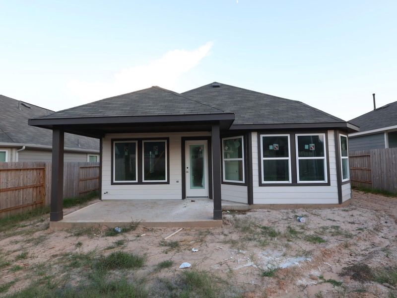Front exterior of a new home in Magnolia Ridge, Magnolia, TX, highlighting curb appeal (Image 2). Front exterior of a new home in Magnolia Ridge, Magnolia, TX, highlighting curb appeal (Image 2).