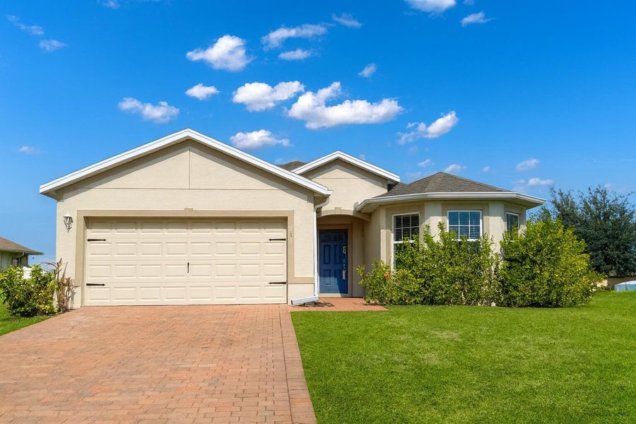 Front exterior of a new home in , Cape Coral, FL, highlighting curb appeal (Image 1). Front exterior of a new home in , Cape Coral, FL, highlighting curb appeal (Image 1).