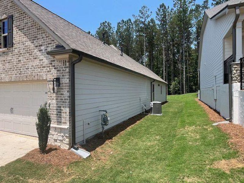 Front exterior of a new home in Soleil Belmont Park, Canton, GA, highlighting curb appeal (Image 26).
