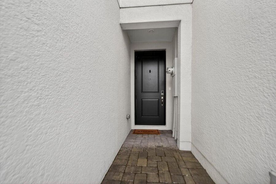 Exterior details and patio area of a home in Enclave at Mangonia Park, West Palm Beach (Image 22).
