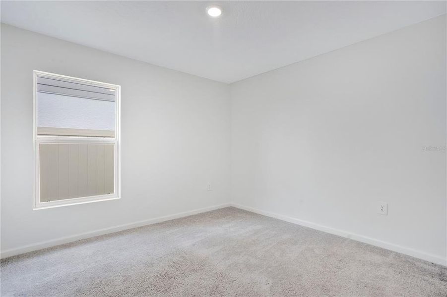 Spacious, unfurnished interior of a new home in Peace Creek Reserve, Winter Haven (Image 14).