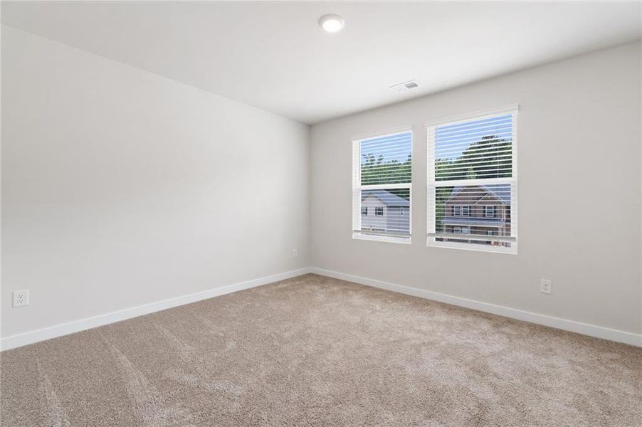 Spacious, unfurnished interior of a new home in Fern Dale, Fairburn (Image 27).
